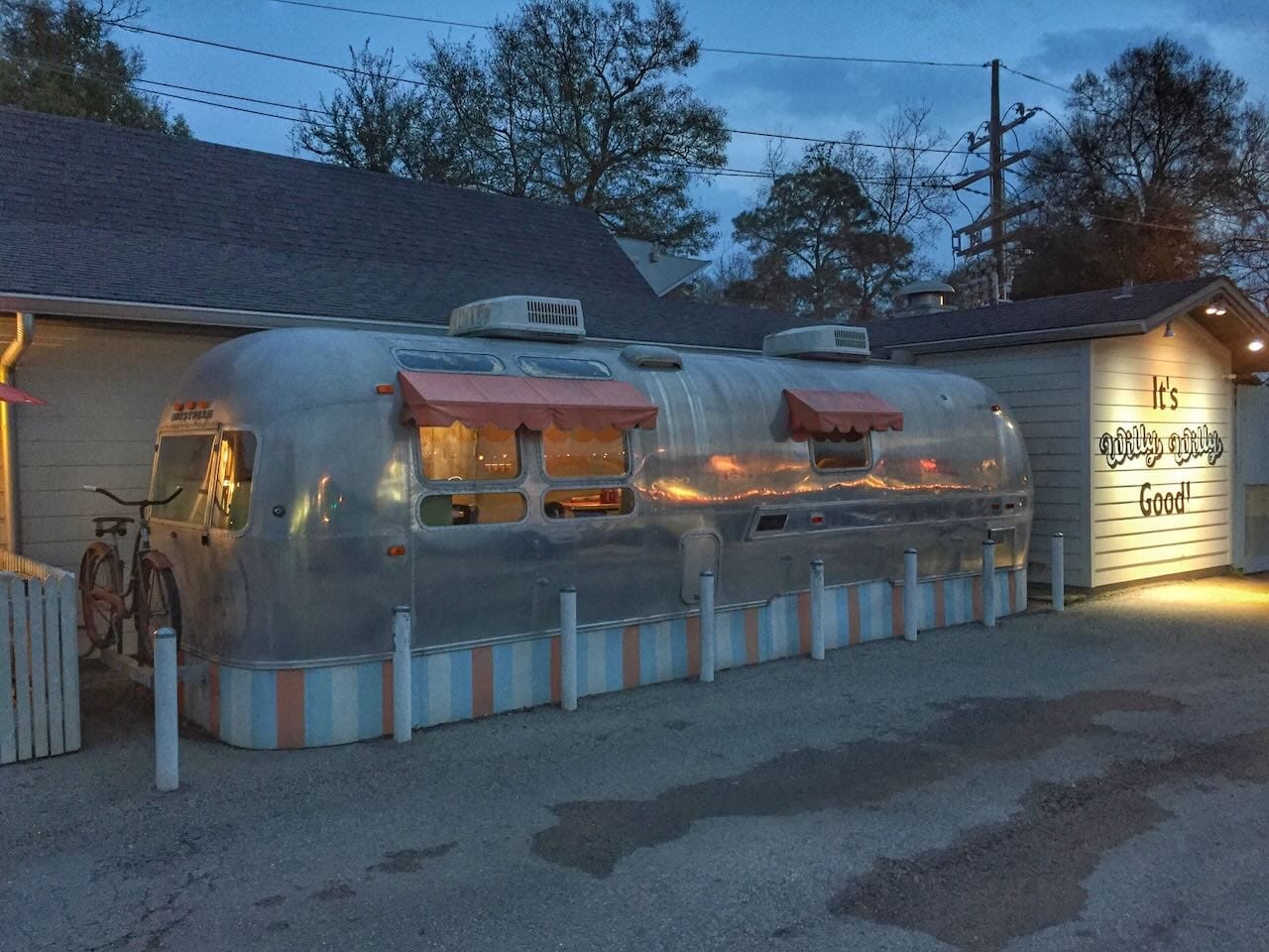 Color photo an Airstream converted into a dining room of a restaurant.